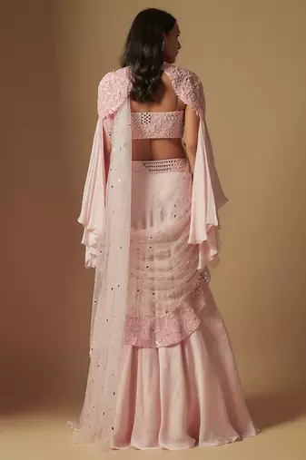 Zenith hand embroidered blouse paired with drape saree and embroidered cape