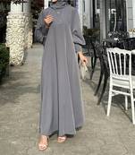 Elegant abaya made from luxurious Prada fabric, featuring cuffed sleeves and a matching belt,