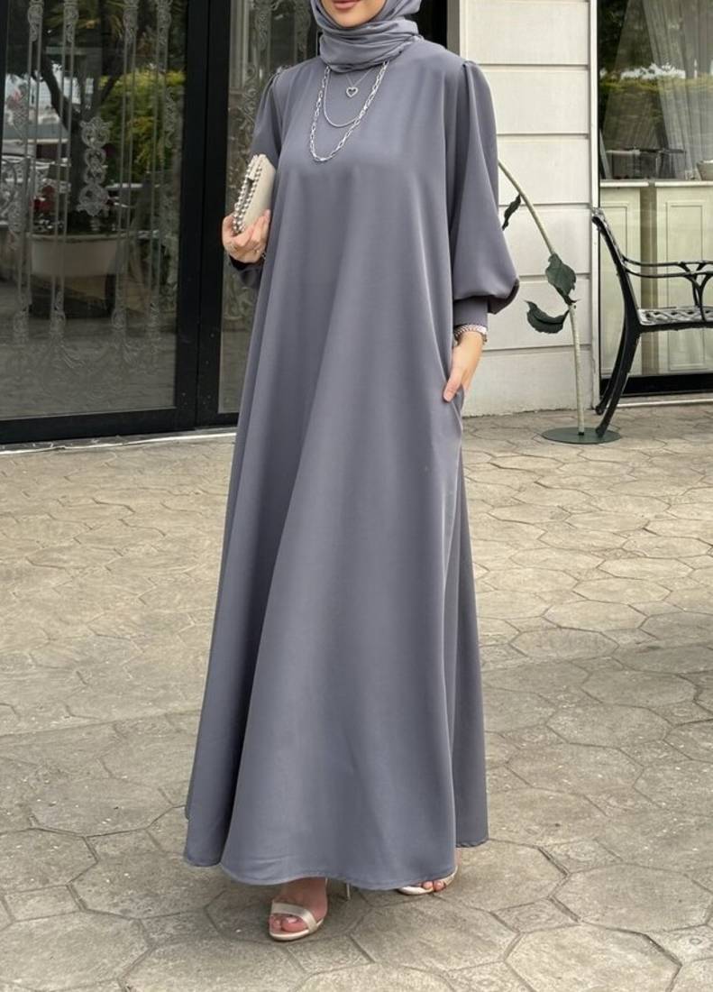 Elegant abaya made from luxurious Prada fabric, featuring cuffed sleeves and a matching belt,