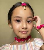 Noor floral set of necklace, 2 bracelets & mang teeka in a dark pink colour
