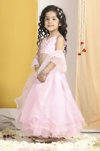 Pearl work on blouse with organza lehanga