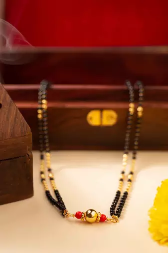Mangalsutra with coral stone pendant and black & gold beaded chain
