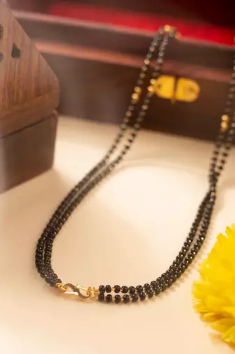 Mangalsutra with coral stone pendant and black & gold beaded chain