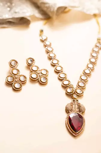 Kundan necklace with red leaf-shaped stone pendant and elephant motif