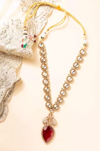 Kundan necklace with red leaf-shaped stone pendant and elephant motif