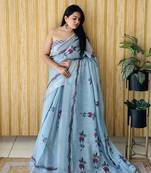 Light teal woven linen saree with blouse piece
