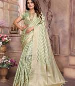 Green woven organza silk saree with blouse piece