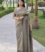 Beige solid design with kalamkari woven border saree