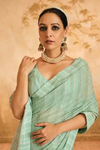 Doree aqua floral chintz saree with unstiched blouse piece