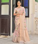 Beige zari woven border with all over pichwai printed saree