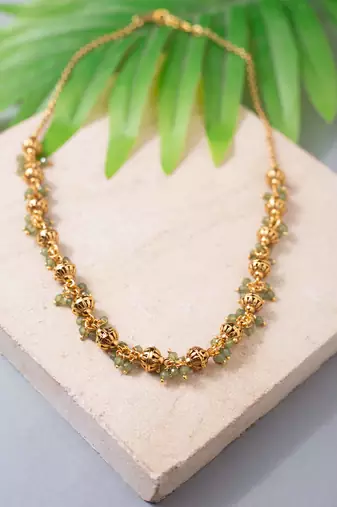 Golden bead and green gemstone necklace