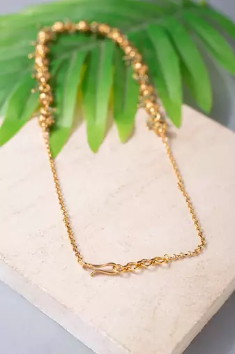 Golden bead and green gemstone necklace