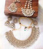 Gold polki necklace set with earrings and tikka