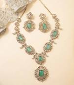 American diamond necklace set with emerald accents