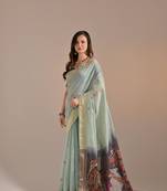 Sea green cow design thread woven pallu with butti weaves