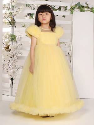 yellow pleated yoke gown with gather puff sleeve net gown for girls 1