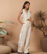 Beige crop top with medium broad pants with abstract print long jacket