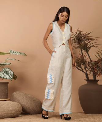Beige crop top with medium broad pants with abstract print long jacket 2