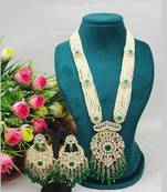 Emerald green beaded kundan necklace set with matching chandelier earrings