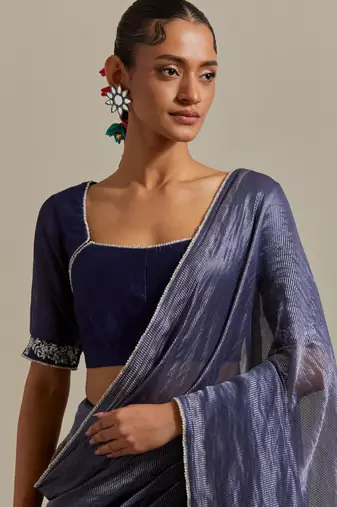 A blue chanderi striped saree with pearl lace detailing
