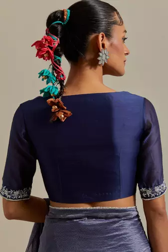 A blue chanderi striped saree with pearl lace detailing