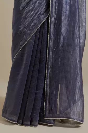 A blue chanderi striped saree with pearl lace detailing
