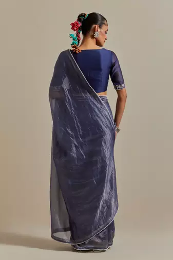 A blue chanderi striped saree with pearl lace detailing