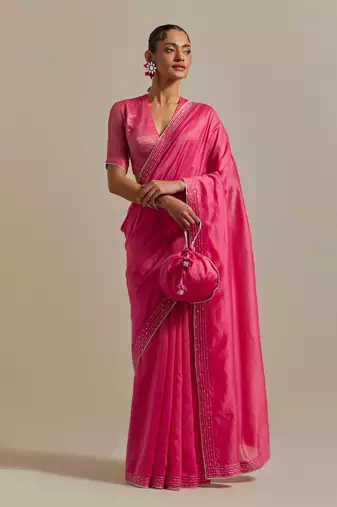 Embroidered chanderi saree paired with a striped blouse