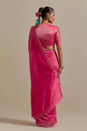 Embroidered chanderi saree paired with a striped blouse