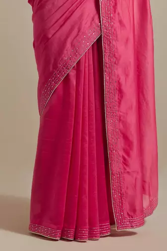 Embroidered chanderi saree paired with a striped blouse