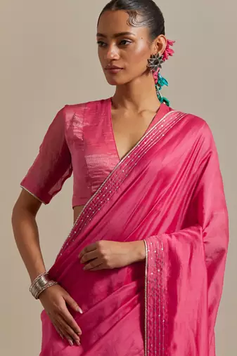 Embroidered chanderi saree paired with a striped blouse