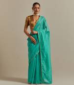 The aqua gold stripes saree