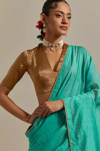 The aqua gold stripes saree