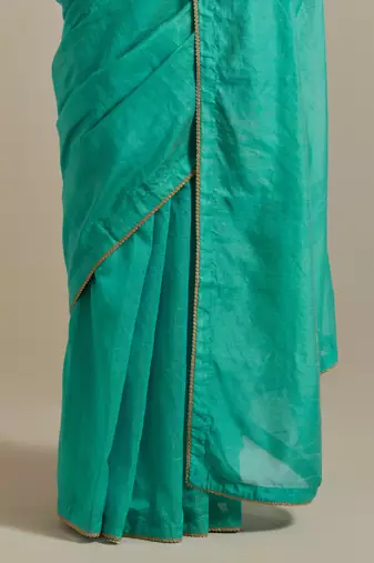 The aqua gold stripes saree