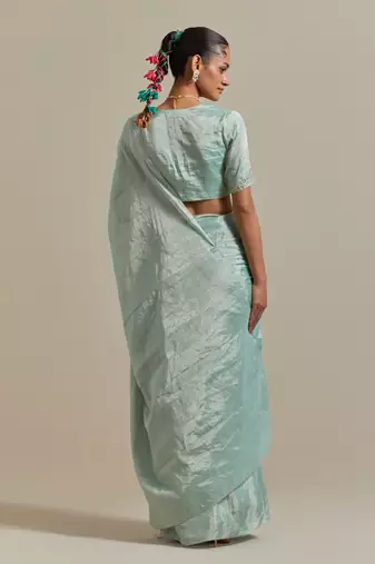 The elegant and subtle mint zari silk saree