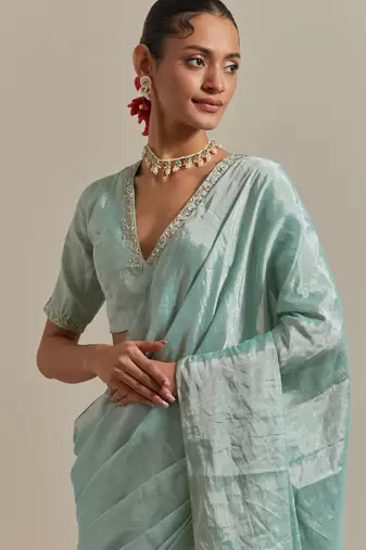 The elegant and subtle mint zari silk saree