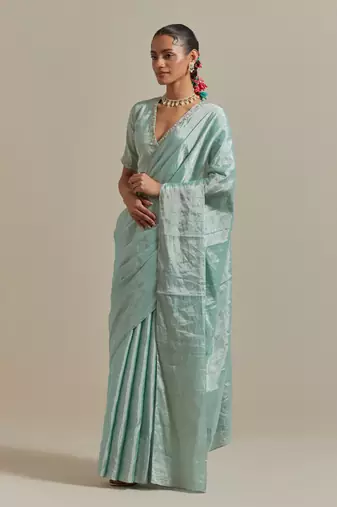The elegant and subtle mint zari silk saree