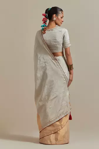 A colour-block saree with silver and gold zari