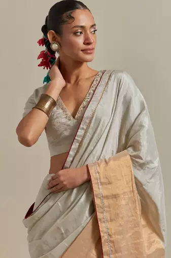 A colour-block saree with silver and gold zari
