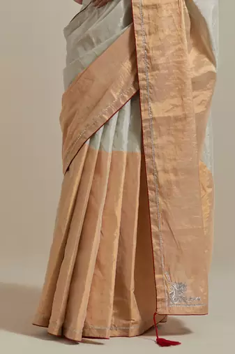 A colour-block saree with silver and gold zari