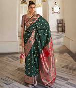 Women's dark green georgette banarasi saree with unstitched blouse piece