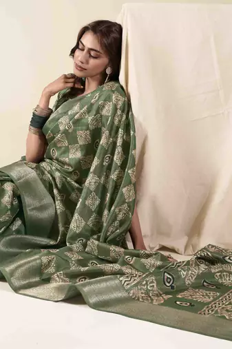 Green zari woven saree with unstitched blouse piece