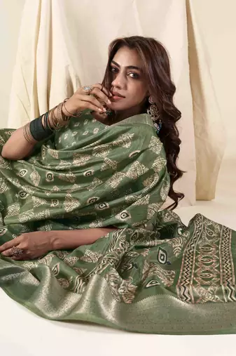 Green zari woven saree with unstitched blouse piece