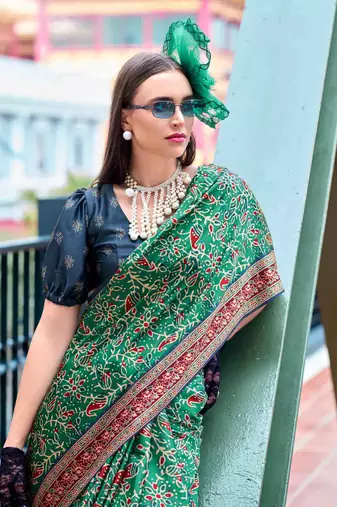 Women's green satin print saree with unstitched blouse piece