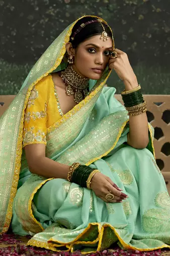 Turquoise Dola Silk Weaving With Sequnice Work Border & Heavy Designer Contras Blouse