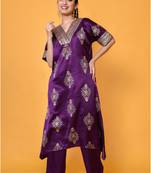 Two piece plum colored hand block print suit with sequence work paired with trouser