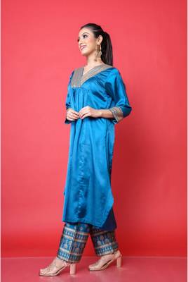Two piece teal colored suit with sequence work paired with hand block print trouser 2