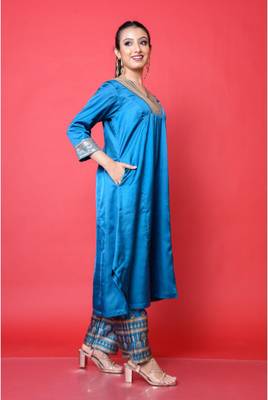 Two piece teal colored suit with sequence work paired with hand block print trouser 3