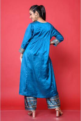 Two piece teal colored suit with sequence work paired with hand block print trouser 4