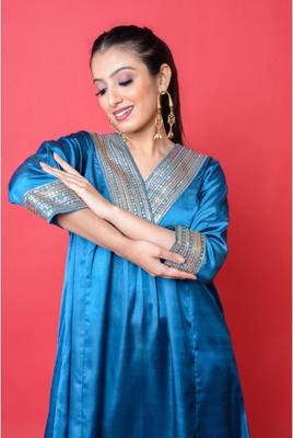 Two piece teal colored suit with sequence work paired with hand block print trouser 5